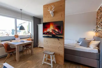 Ein Bett oder Betten in einem Zimmer der Unterkunft Ferienwohnung BergChalet 2 mit Balkon