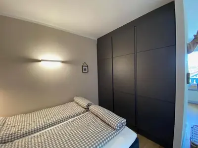 Ein Bett oder Betten in einem Zimmer der Unterkunft Ferienwohnung Bergchalet 3 mit Balkon