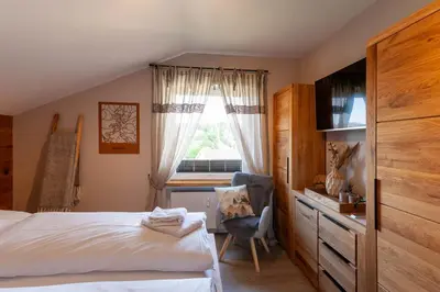 Ein Bett oder Betten in einem Zimmer der Unterkunft Ferienwohnung Aussichts-Punkt mit Wärmekabine und Traumblick