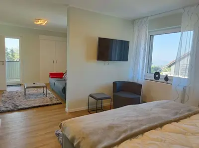 Ein Bett oder Betten in einem Zimmer der Unterkunft Ferienhaus Harzer Bergwelten mit Sauna, Grill und Garten