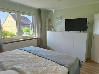 Ein Bett oder Betten in einem Zimmer der Unterkunft Ferienhaus Harzer Bergwelten mit Sauna, Grill und Garten