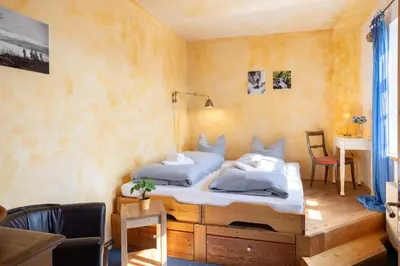 Ein Bett oder Betten in einem Zimmer der Unterkunft Ferienhaus am Glockenberg