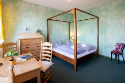 Ein Bett oder Betten in einem Zimmer der Unterkunft Ferienhaus am Glockenberg
