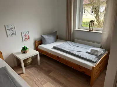 Ein Bett oder Betten in einem Zimmer der Unterkunft Urlaubshaus-Braunlage Wohnung 1