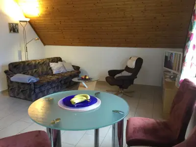 Ein Sitzbereich in der Unterkunft Appartements Am Hexenstieg