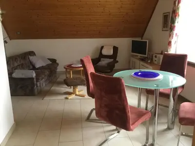 Ein Sitzbereich in der Unterkunft Appartements Am Hexenstieg
