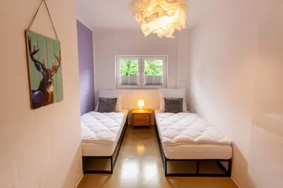 Ein Bett oder Betten in einem Zimmer der Unterkunft Ferienwohnung Familien Loft im Haus Tannenblick Lofts