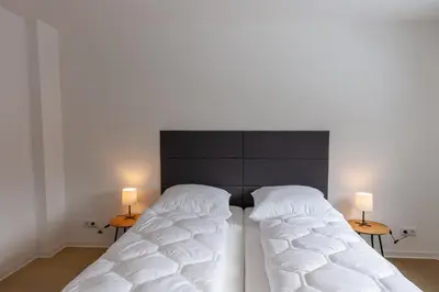 Ein Bett oder Betten in einem Zimmer der Unterkunft Ferienwohnung Garten Loft im Haus Tannenblick Lofts