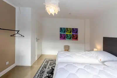 Ein Bett oder Betten in einem Zimmer der Unterkunft Ferienwohnung Garten Loft im Haus Tannenblick Lofts