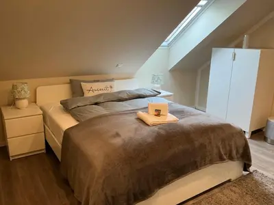 Ein Bett oder Betten in einem Zimmer der Unterkunft Haus Bergstadtblick Fewo Auszeit