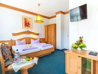 Ein Bett oder Betten in einem Zimmer der Unterkunft Hotel und Restaurant Piccolo