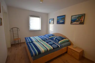 Ein Bett oder Betten in einem Zimmer der Unterkunft Ferienwohnung im Weinbergweg