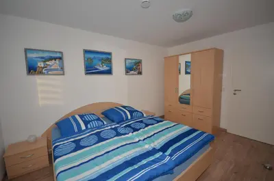 Ein Bett oder Betten in einem Zimmer der Unterkunft Ferienwohnung im Weinbergweg