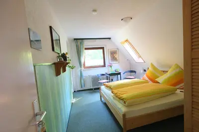 Ein Bett oder Betten in einem Zimmer der Unterkunft Frauenpension Arleta - Women only