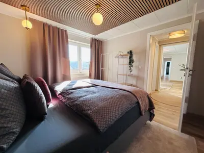 Ein Bett oder Betten in einem Zimmer der Unterkunft Harzburg-Living Wohnung Goethe`s Bergblick