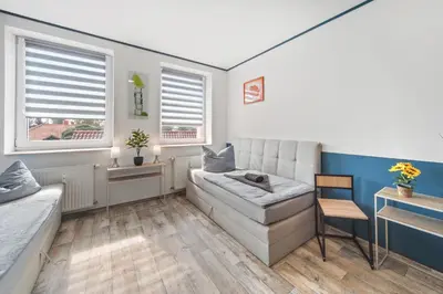 Ein Sitzbereich in der Unterkunft Wohnung Stadtrand, 4 Personen, nahe Bahnhof und See