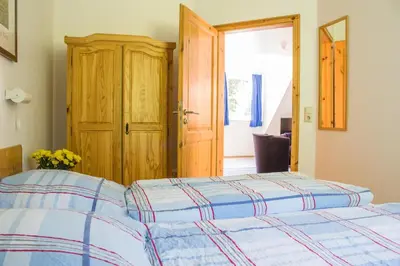 Ein Bett oder Betten in einem Zimmer der Unterkunft Ferienwohnung Ferienhäuser am Brocken, 80 qm 3 Schlafzimmer