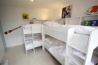 Ein Bett oder Betten in einem Zimmer der Unterkunft Ferienwohnung 