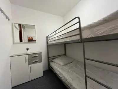 Ein Bett oder Betten in einem Zimmer der Unterkunft Kleine Residenz