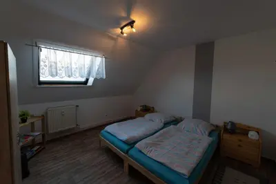 Ein Bett oder Betten in einem Zimmer der Unterkunft Ferienwohnung Zeiß