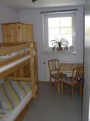 Ein Bett oder Betten in einem Zimmer der Unterkunft Ferienwohnung 