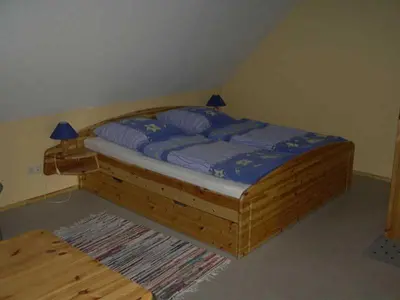 Ein Bett oder Betten in einem Zimmer der Unterkunft Ferienwohnung 
