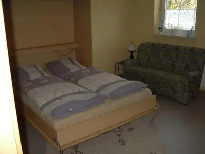Ein Bett oder Betten in einem Zimmer der Unterkunft Ferienwohnung 
