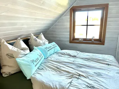 Ein Bett oder Betten in einem Zimmer der Unterkunft Ferienhaus HarzHase