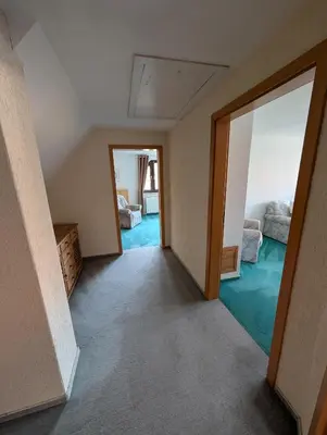 Ein Bett oder Betten in einem Zimmer der Unterkunft Ferienhaus Bornholzweg in Quedlinburg 157 qm