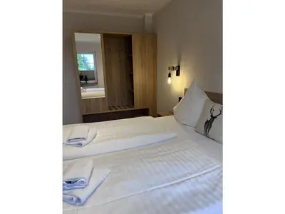 Ein Bett oder Betten in einem Zimmer der Unterkunft Kleines Berghaus - App 2