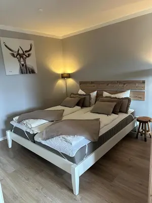 Ein Bett oder Betten in einem Zimmer der Unterkunft BergHerzl - Braunlage
