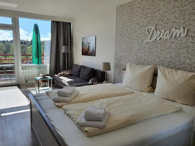 Ein Bett oder Betten in einem Zimmer der Unterkunft Harz Dream - Vier Jahreszeiten