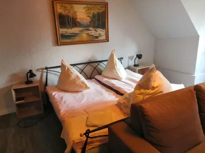 Ein Bett oder Betten in einem Zimmer der Unterkunft Hotel und Gaststätte Bierstübchen