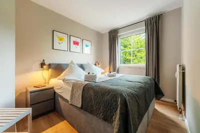 Ein Bett oder Betten in einem Zimmer der Unterkunft Harzglanz FeWo's Ariadel in Braunlage