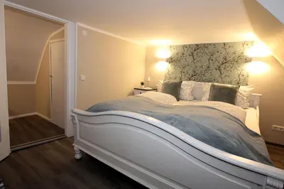 Ein Bett oder Betten in einem Zimmer der Unterkunft Ferienhaus Charlotte