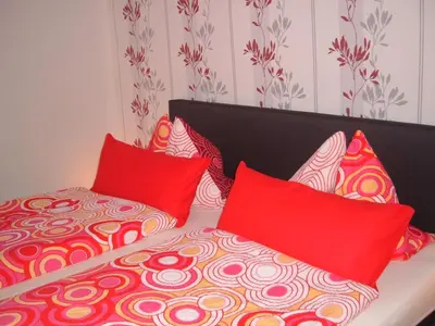 Ein Bett oder Betten in einem Zimmer der Unterkunft Ferienwohnungen Pook