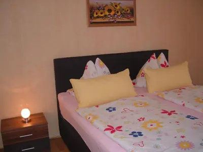 Ein Bett oder Betten in einem Zimmer der Unterkunft Ferienwohnungen Pook