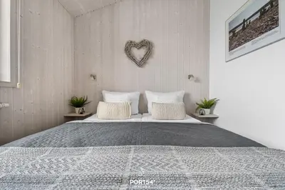 Ein Bett oder Betten in einem Zimmer der Unterkunft Ferienhaus BergZauber Lodge - Sankt Andreasberg im Harz