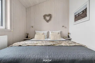 Ein Bett oder Betten in einem Zimmer der Unterkunft Ferienhaus Talblick Lodge - Neles Nest - Sankt Andreasberg im Harz