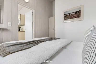 Ein Bett oder Betten in einem Zimmer der Unterkunft Ferienhaus HarzTraum Lodge - Sankt Andreasberg im Harz