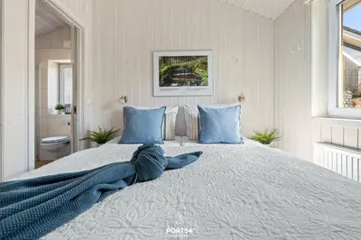 Ein Bett oder Betten in einem Zimmer der Unterkunft Ferienhaus Harzliebe - Sankt Andreasberg im Harz