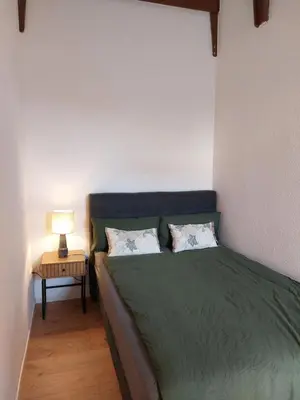 Ein Bett oder Betten in einem Zimmer der Unterkunft Ferienwohnung Hang zur Villa