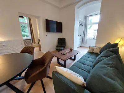 Ein Sitzbereich in der Unterkunft Ferienwohnung Hang zur Villa
