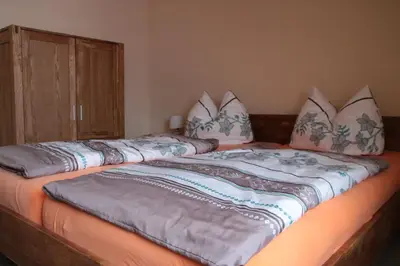 Ein Bett oder Betten in einem Zimmer der Unterkunft Ferienwohnungen Grüne Tanne