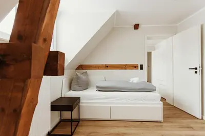 Ein Bett oder Betten in einem Zimmer der Unterkunft Harzchalet Brockenbahn 2B