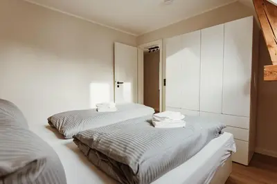 Ein Bett oder Betten in einem Zimmer der Unterkunft Harzchalet Brockenbahn 2B