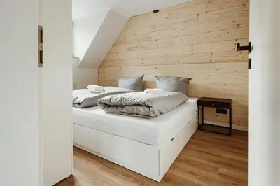 Ein Bett oder Betten in einem Zimmer der Unterkunft Harzchalet Brockenbahn 2B