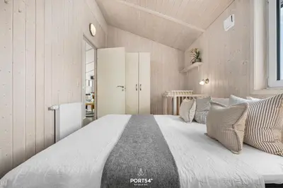 Ein Bett oder Betten in einem Zimmer der Unterkunft Ferienhaus Bergnest - Sankt Andreasberg im Harz