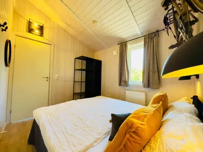 Ein Bett oder Betten in einem Zimmer der Unterkunft Ferienhaus Trollblume - Sankt Andreasberg im Harz