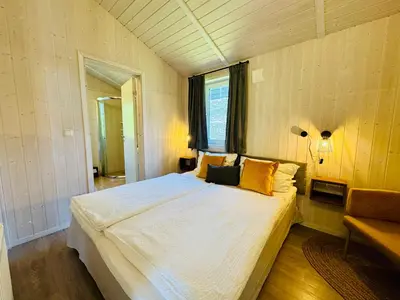 Ein Bett oder Betten in einem Zimmer der Unterkunft Ferienhaus Trollblume - Sankt Andreasberg im Harz